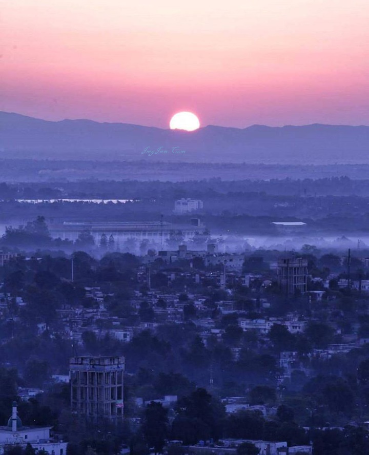 Simple Wow.....Twin cities, most area of Rawalpindi and sun setting behind the Margalla Hills.